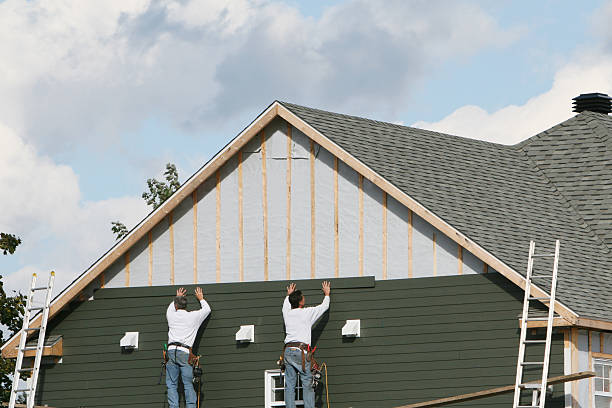 Professional Storm Damage Siding Repair technician working in Karthaus, PA